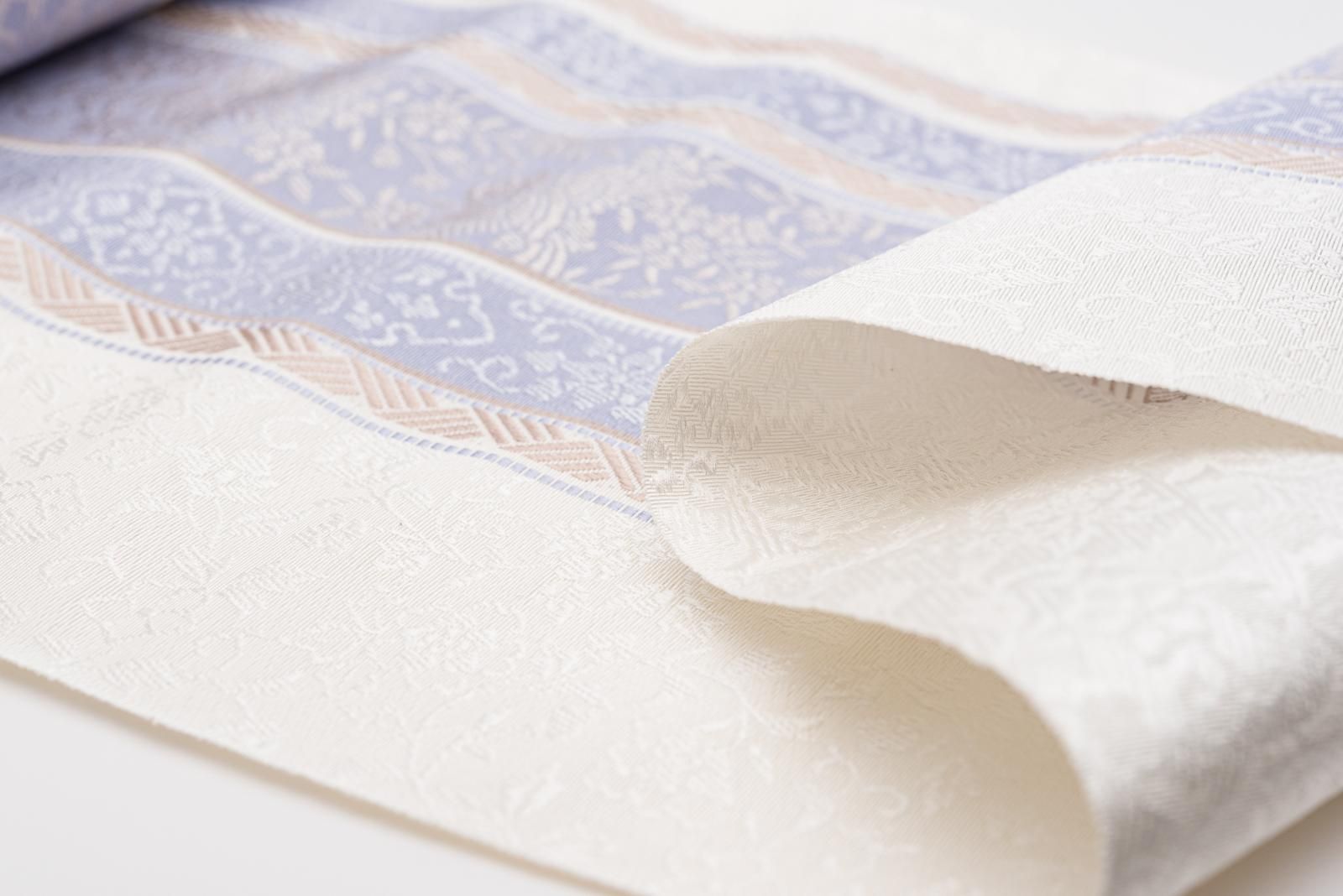 お仕立て付き】新品 博多八寸名古屋帯 黒穂間道 花鳥 藤色 - からん