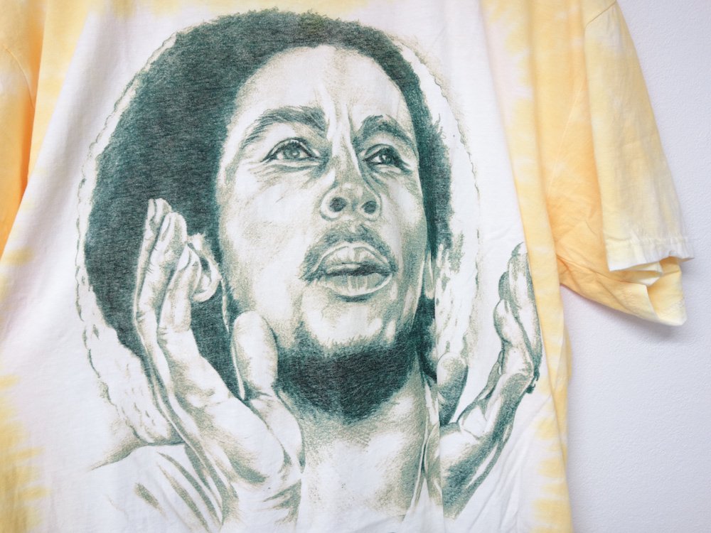  ե Bob Marley  T 