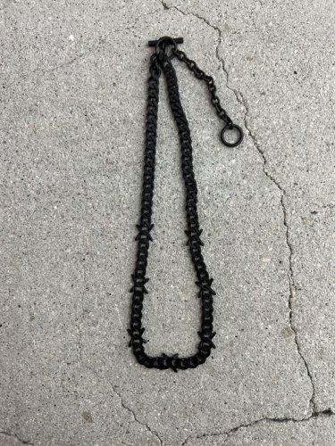 LAD MUSICIAN BARBED WIRE NECKLACE