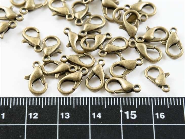 カニカン アンティークゴールド 12mm×7mm 約30個 30ヶ 留め具 フック ナスカン アクセサリーパーツ パーツ - ハンドメイド アクセサリー パーツ レジン用品のネット通販 紗や工房 カニカン アンティークゴールド 12mm×7mm 約30個 30ヶ 留め具 フック ナスカン アクセサリーパーツ パーツ - ハンドメイド アクセサリー パーツ レジン用品のネット通販 紗や工房