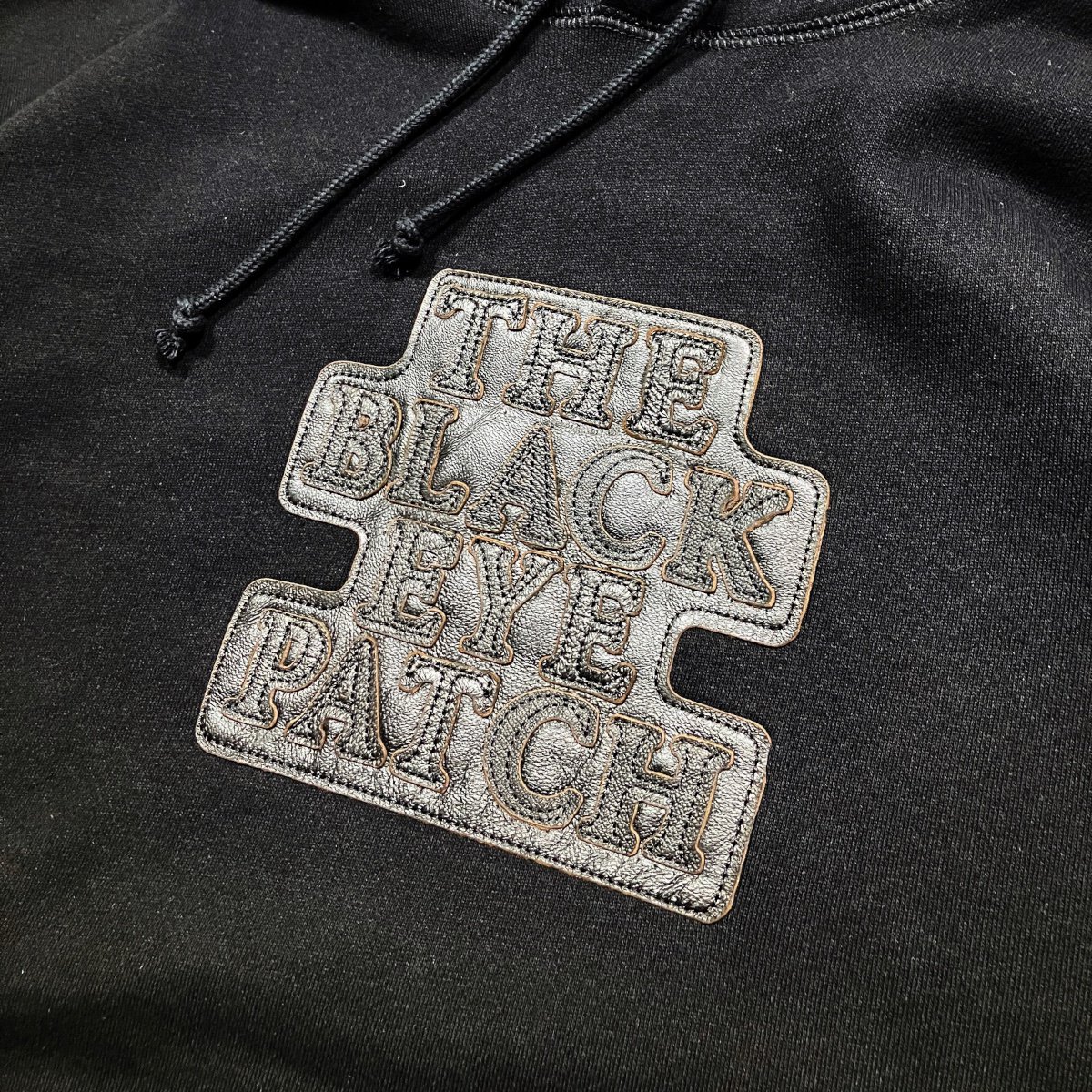 BlackEyePatch《ブラックアイパッチ》| LEATHER OG LABEL HOODIE