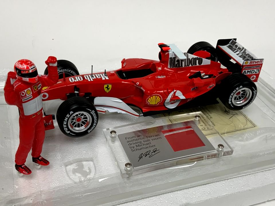 1/18 Hotwheels Ferrari F2004 F1 with Schumacher's used race suit