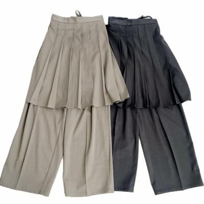 Pleated pants with wrap pleated skirt