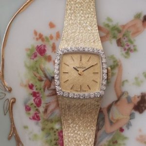 オメガ　ダイヤ巻き 14金イエローゴールド ブレス一体型 レディースアンティーク腕時計